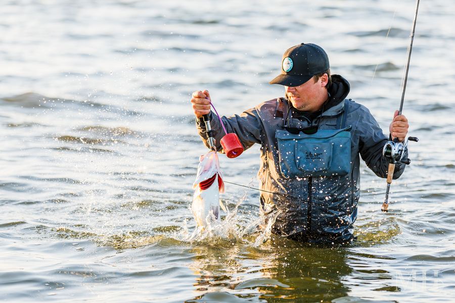 Captain Hunter Campbell of Coastal Hooker Guide Service with a speckled trout, Corpus Christi