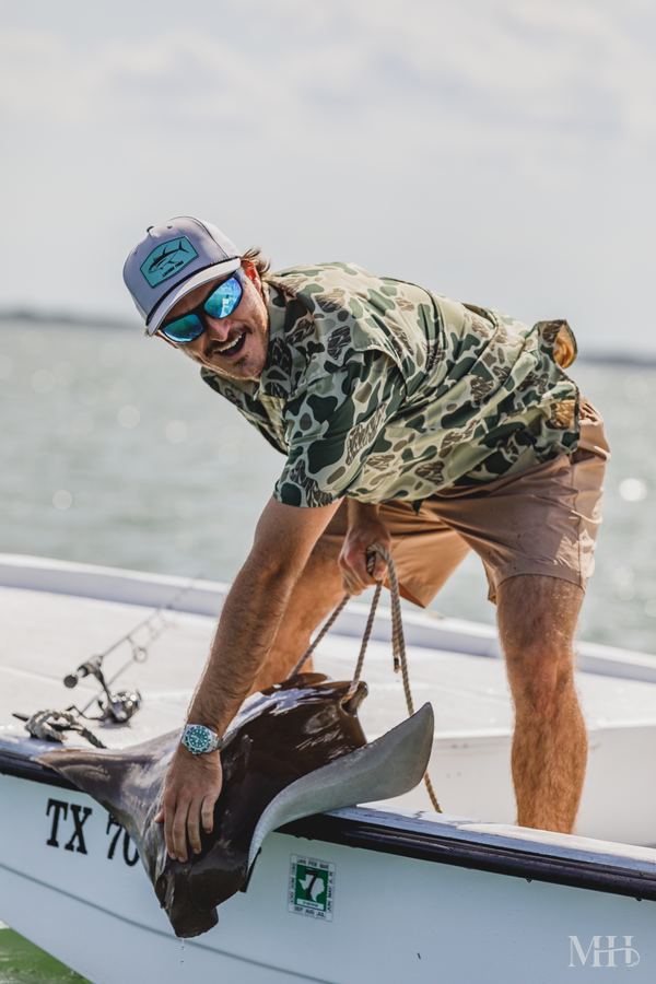 Ryan Carlson holding a cownose ray, Corpus Christi